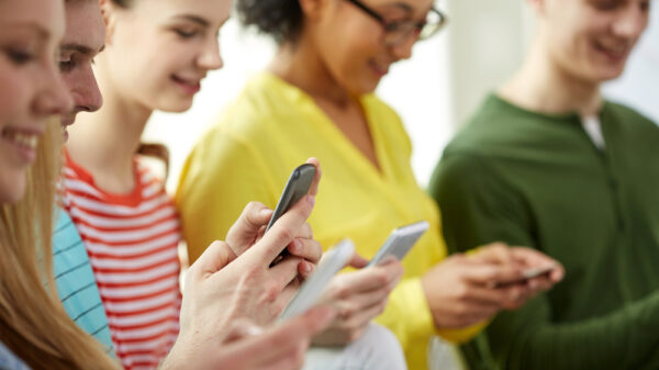 young people looking at their mobile devices