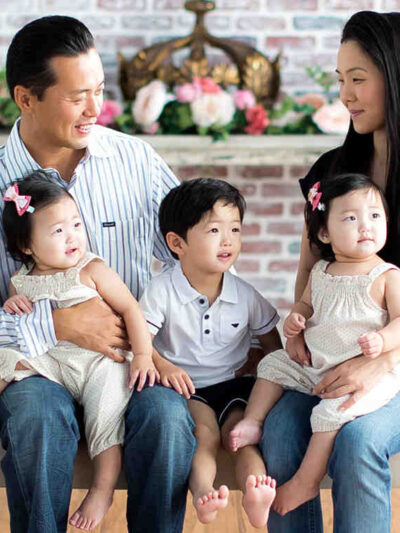 Mark Hwang with his wife, young son, and young twin daughters