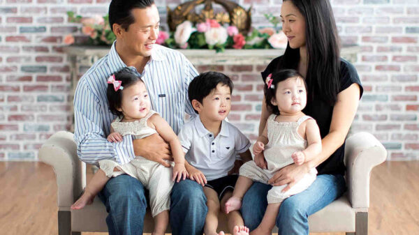 Mark Hwang with his wife, young son, and young twin daughters