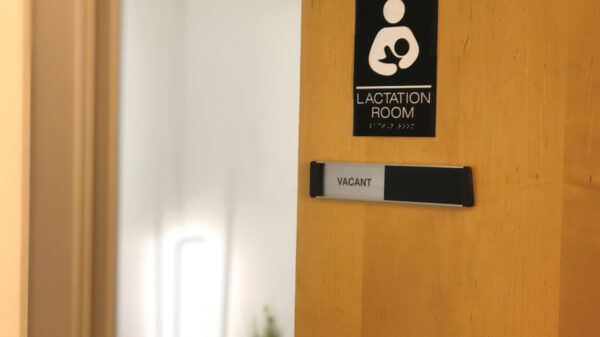 Office door with placard that reads: Lactation room