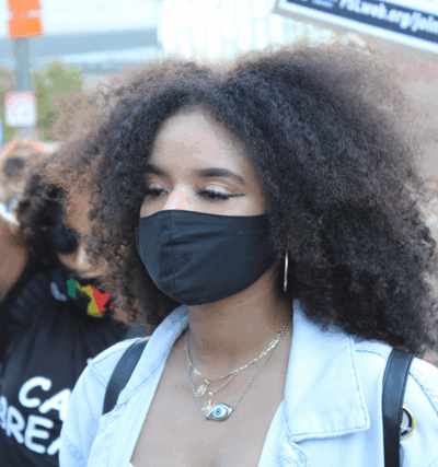 LAUSD student Catherine Estrada attends a rally with mask on