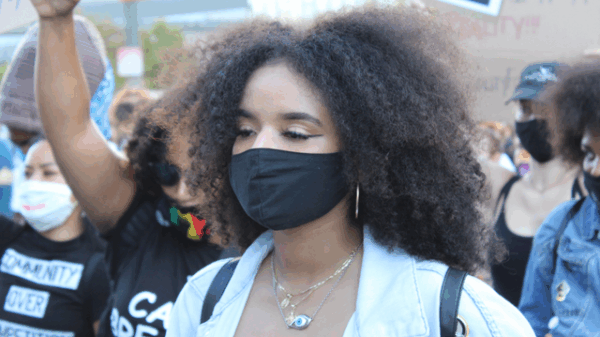 LAUSD student Catherine Estrada attends a rally with mask on
