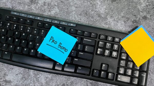 Image of keyboard with blue note with text that reads "Pro Bono"