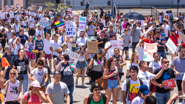 Crowd holding signs