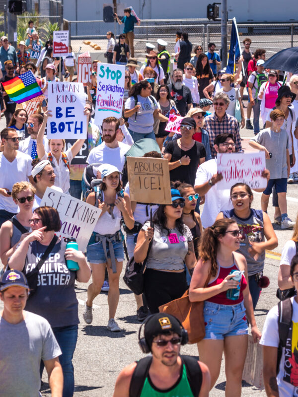 Crowd holding signs