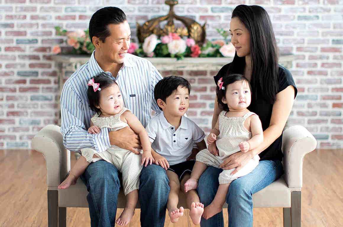 Mark Hwang with his wife, young son, and young twin daughters