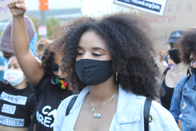 LAUSD student Catherine Estrada attends a rally with mask on