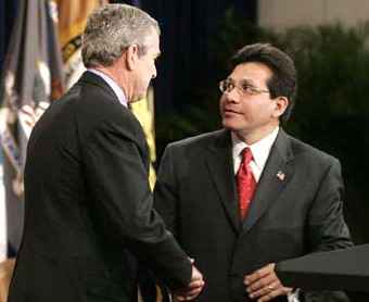 Bush and Gonzales shaking hands