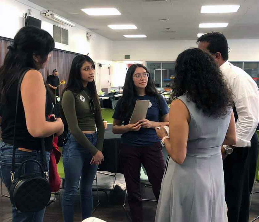 Students at Pomona Unified District talking to school board members