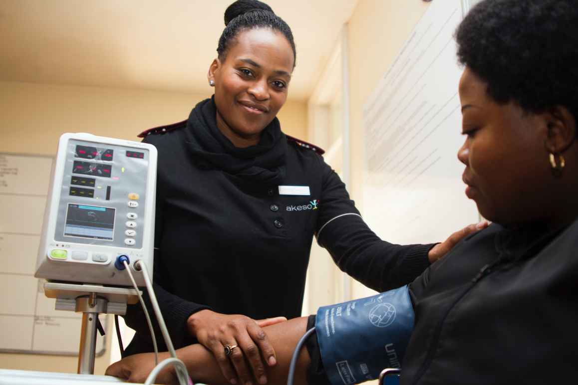 A nurse taking the blood pressure of a patient