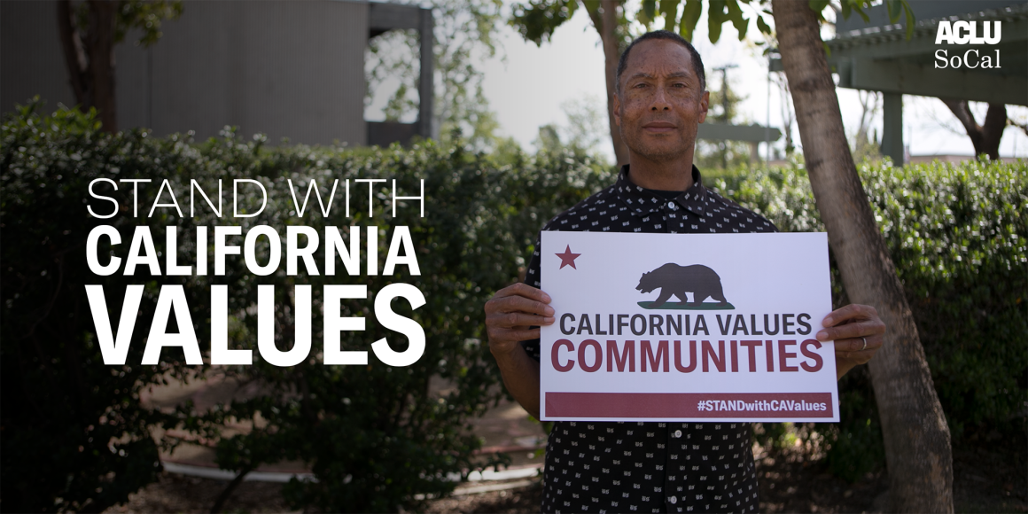 Stand with California Values. Man holding sign that reads: California Values Communities