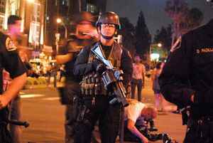 A police officer prepares to break up a protest in downtown Anaheim in July 2012.  (Photo: Nick Gerda/Voice of OC)