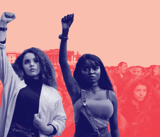 Women raising fists in front of United States Capitol