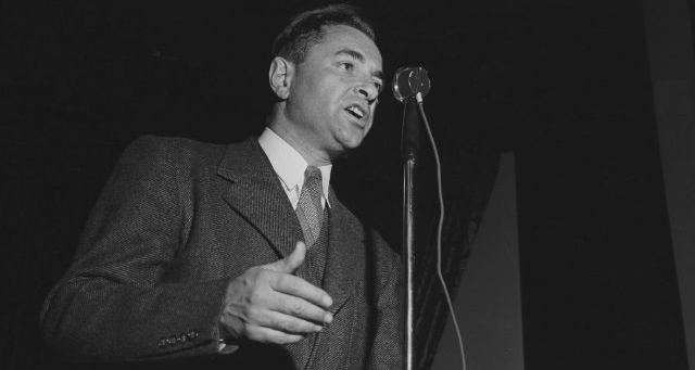 Black and white photo of A.L. Wirin speaking to striking workers, c. 1942